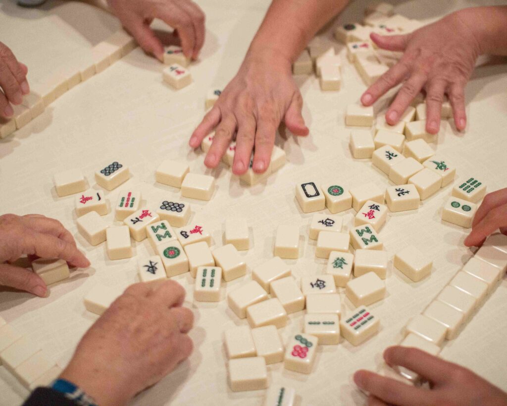A mahjong board in play, representing focus, strategy, and small wins in life.