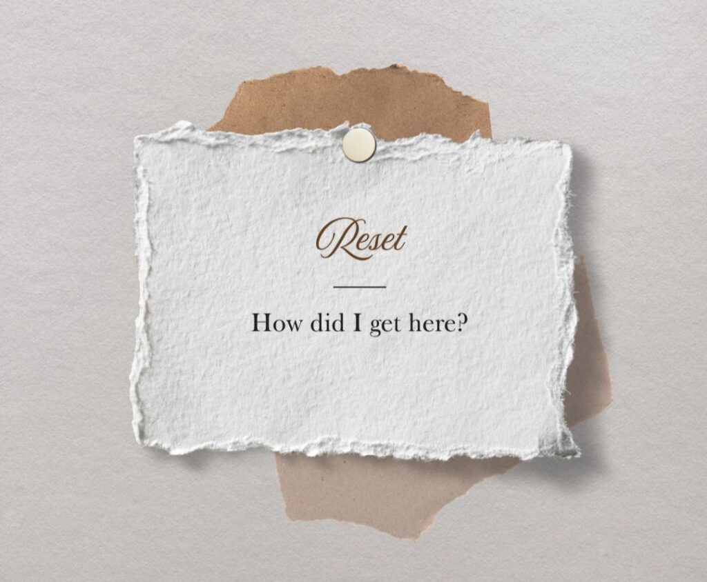 “Reset concept with text ‘How did I get here?’ on textured paper, representing reflection during a life reset.”