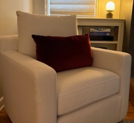 Cozy armchair in a softly lit room representing clarity, focus, and a calm space to reflect on what matters most feature