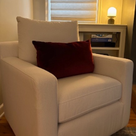 Cozy armchair in a softly lit room representing clarity, focus, and a calm space to reflect on what matters most feature